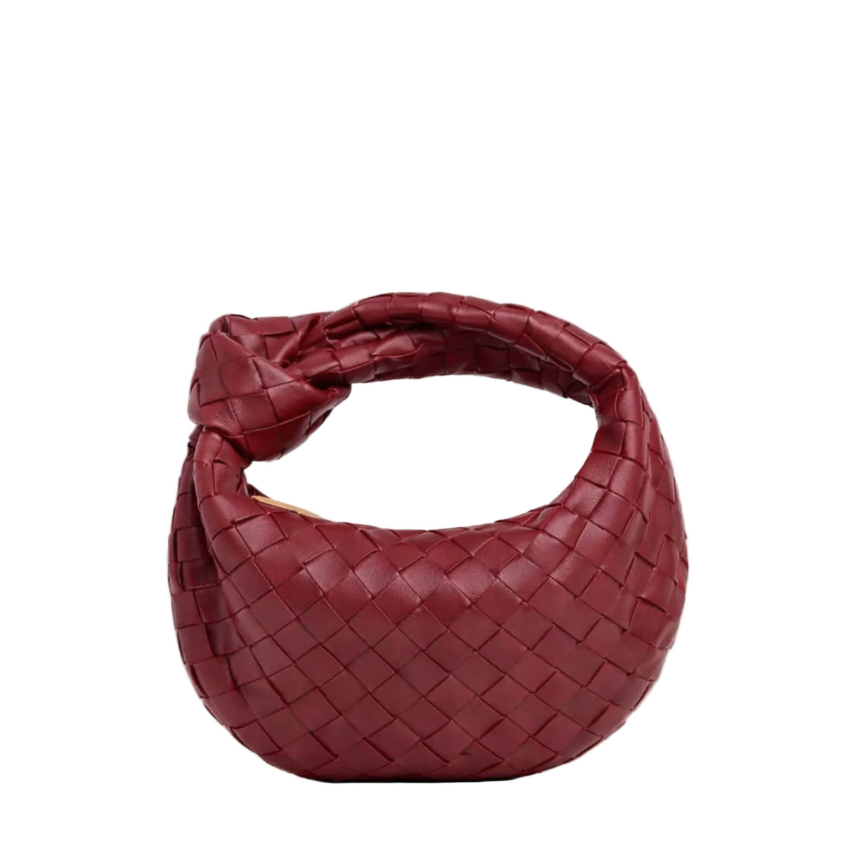 Woven vegan leather knotted mini bag styled as an outfit accessory
