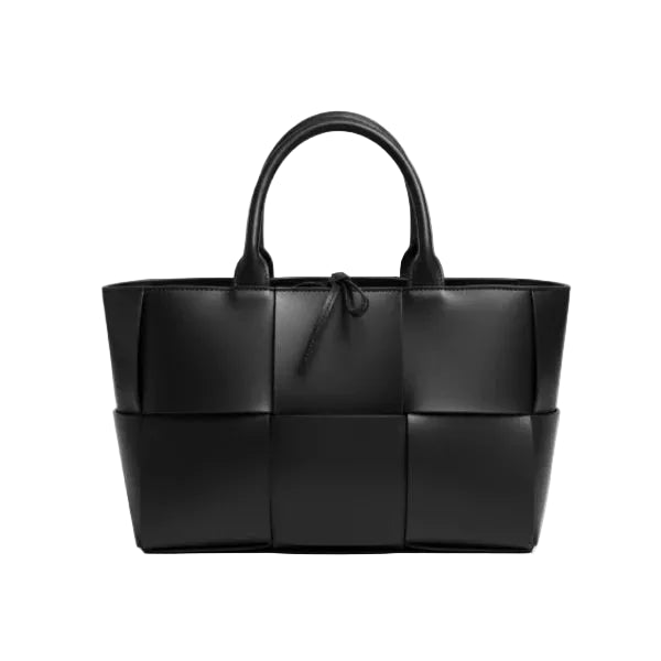 Front view of Aurelia black genuine leather tote bag with woven texture and leather handles, featuring a minimalistic design