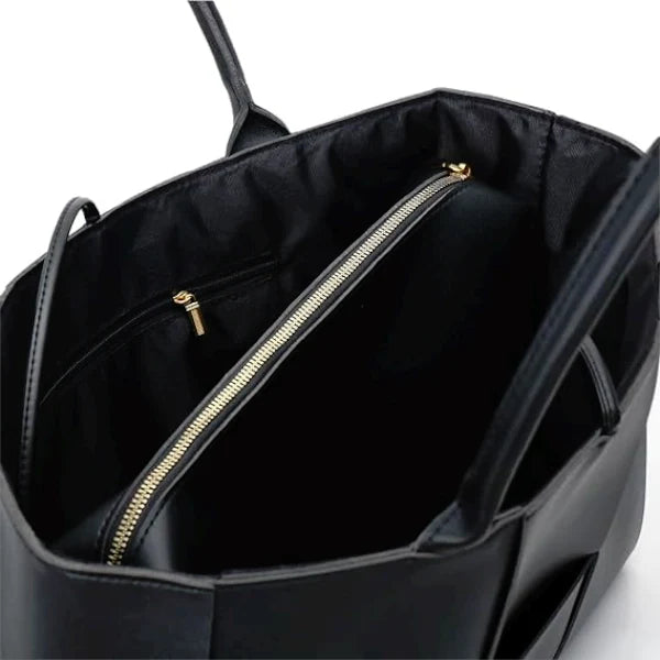 Interior view of Aurelia black genuine leather tote bag with spacious black lining and a gold zipper pocket for organization