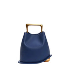 Front view of a Blue Izelia top grain leather crossbody bag with a gold handle on a white background