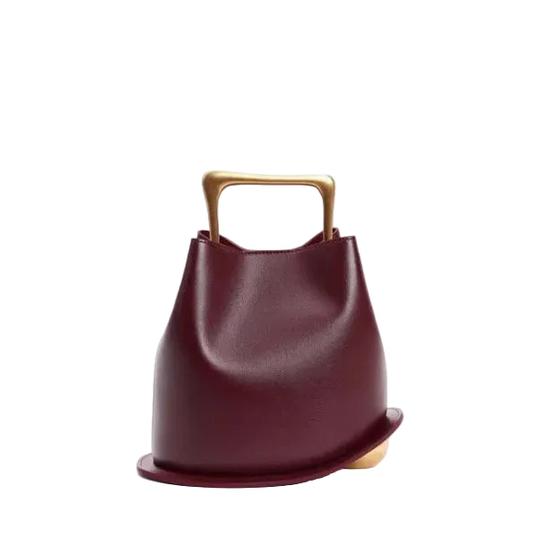 Front view of a Wine Red Izelia top grain leather crossbody bag with gold handle on a white background