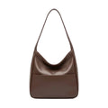 Front view of Seliora vegan leather shoulder bag in coffee color with minimalist design and front pocket