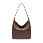 Front view of Seliora vegan leather shoulder bag in coffee color with minimalist design and front pocket