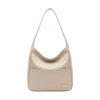 Front view of Seliora vegan leather shoulder bag in off-white color with sleek design and front pocket