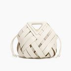 Seren Vegan Leather Bucket Bag in white, front studio view showing sculptural woven body with drawstring sides and triangle handle