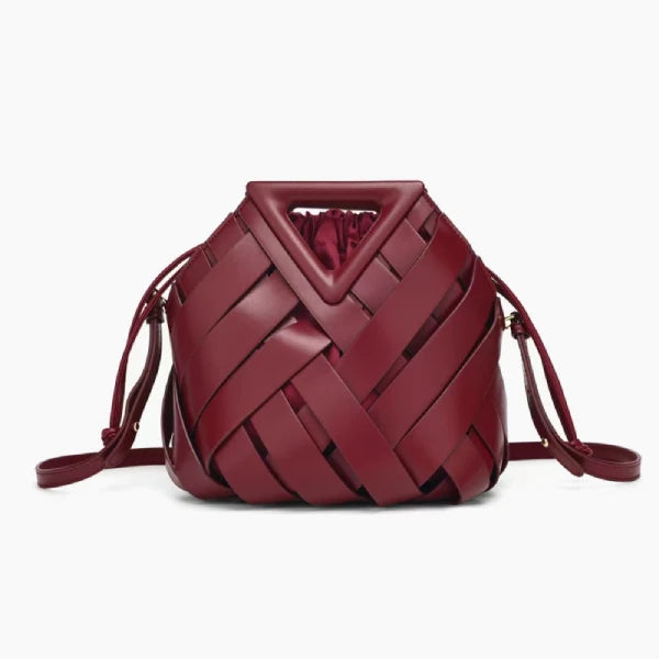 Seren Vegan Leather Bucket Bag in wine red, front studio view showing sculptural woven body with drawstring sides and triangle handle