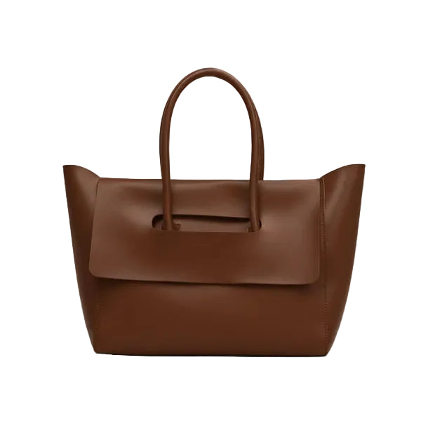 Front view of brown vegan leather tote bag featuring a contemporary shape with a flap closure and clean lines for a modern aesthetic
