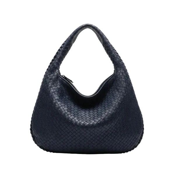 Front view of dark blue woven vegan leather hobo bag with a structured design, wide handle, and zipper opening