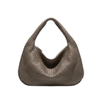 Front view of grey woven vegan leather hobo bag with zipper closure and wide handle