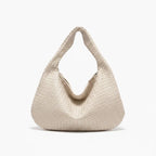 Front view of white woven vegan leather hobo bag with zipper closure and wide handle