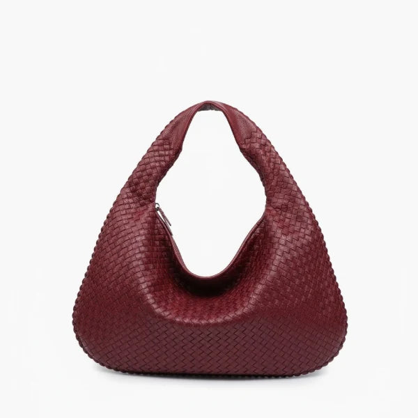 Front view of wine red woven vegan leather hobo bag with wide handle, zipper opening, and detailed texture